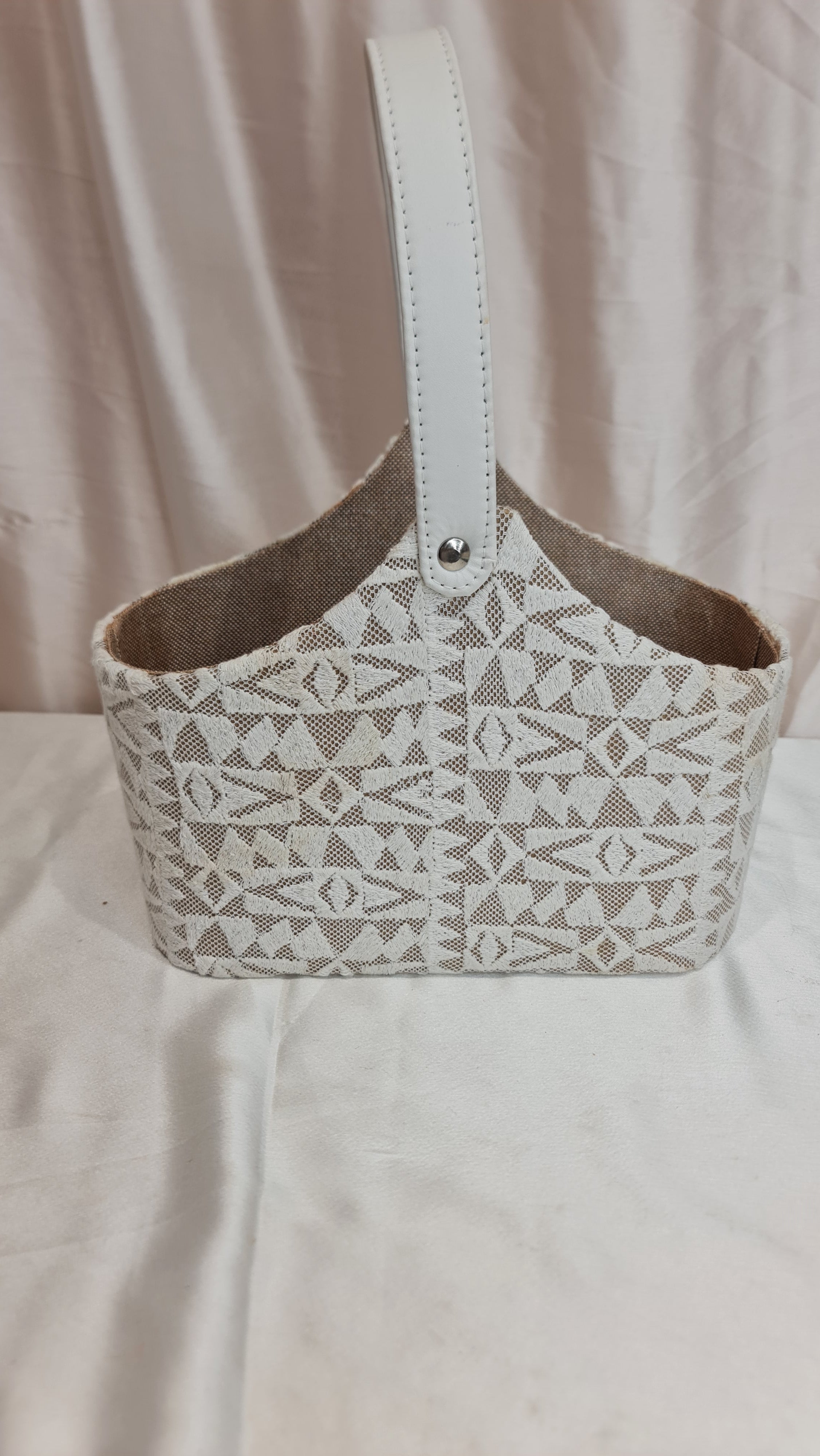 Patterned dog muzzle on a light fabric background