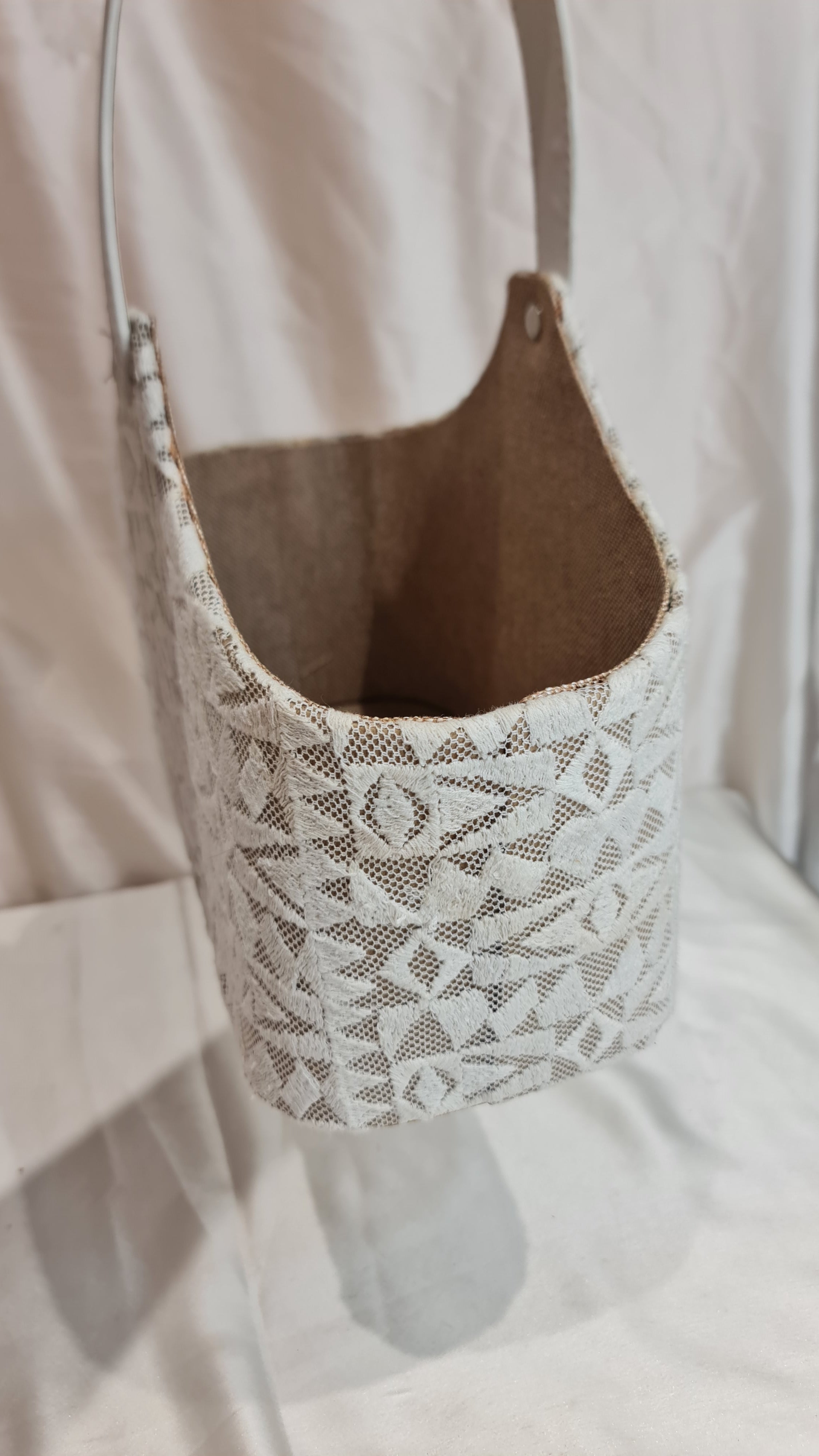 Shoe with lace pattern on a light fabric background