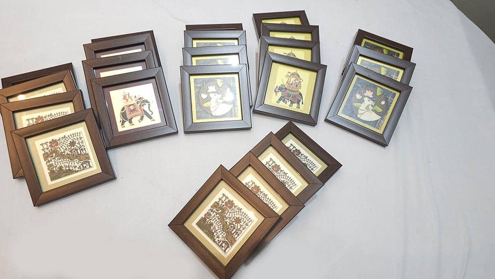Set of framed artworks on a light gray surface