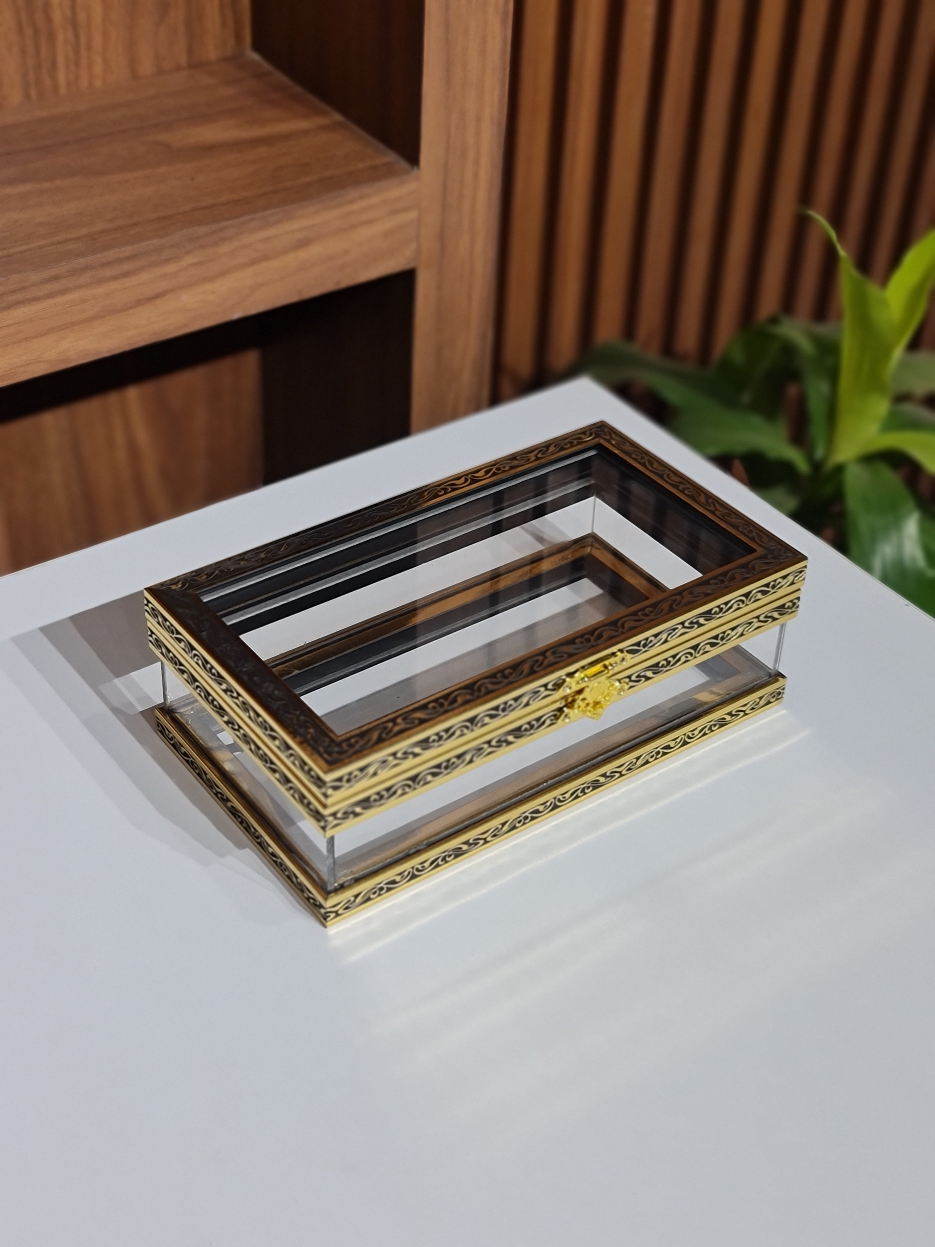 Set of decorative picture frames on a white surface with a wooden shelf in the background.