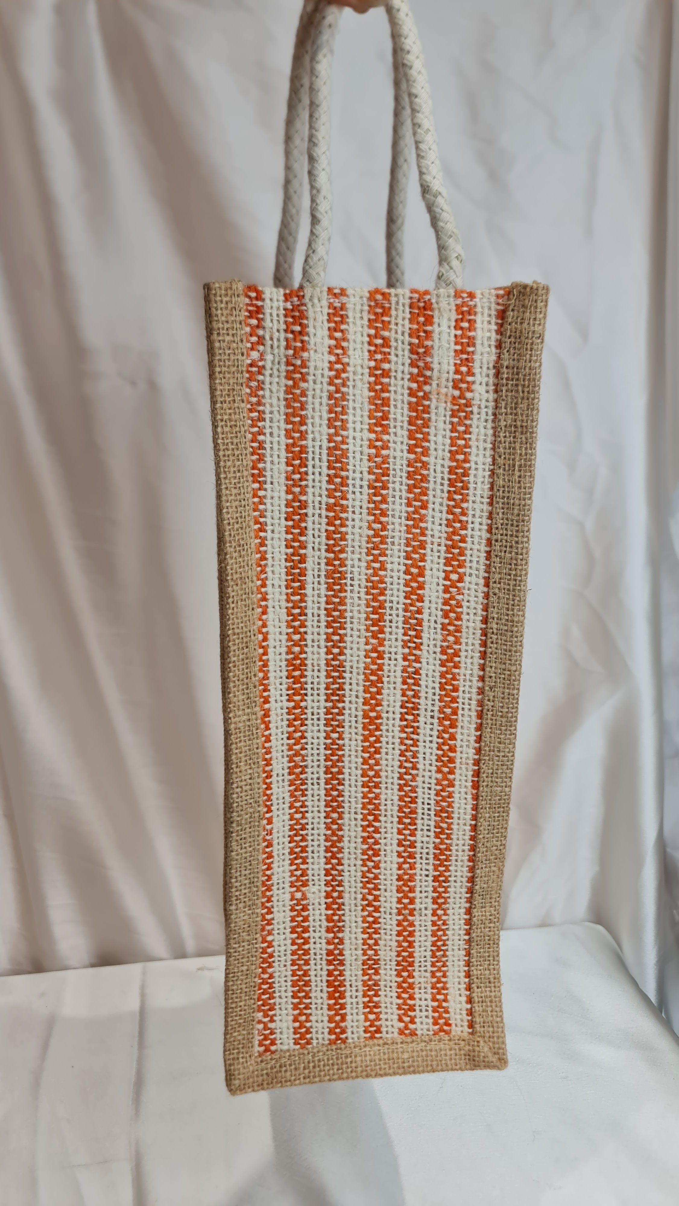 Rectangular pouch with striped pattern on a white fabric background