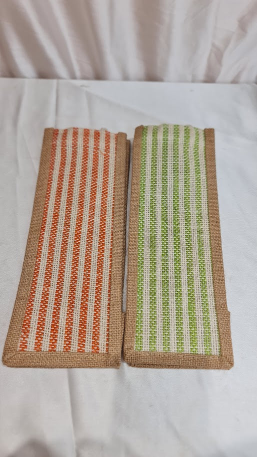 Two woven coasters, one with orange stripes and the other with green pattern, on a white surface.
